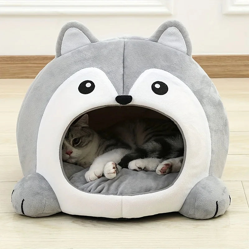 A gray and white plush tent house shaped like an owl or cat cave for small pets.