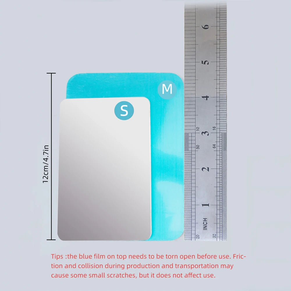 Silver aluminum cooling pad with a blue film on top, shown next to a ruler.