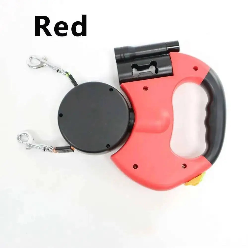 A red double dog retractable leash with a black handle and built-in flashlight.