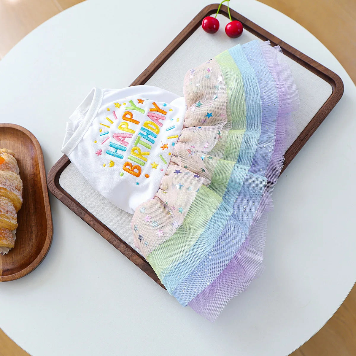 Elegant dog birthday suit featuring a white shirt with happy birthday text and a rainbow colored fabric overlay