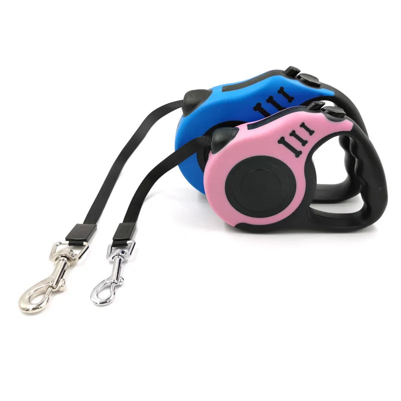 A pink and blue retractable dog leash with a comfortable grip is shown against a white background.