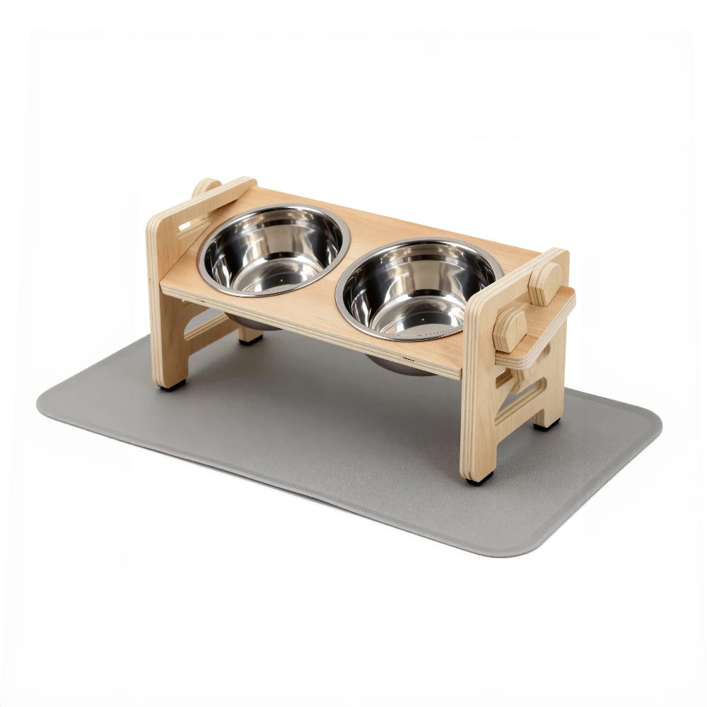 A wooden elevated puppy bowl set with a tilted stand and food mat.