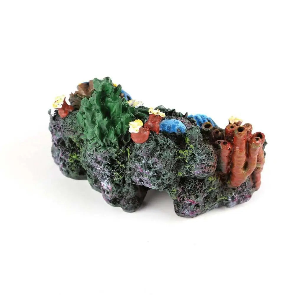 A sculpted ornament resembling a coral reef island with various colored sea creatures and textured green rock.