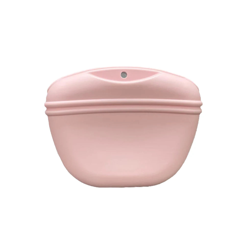 A pink silicone dog treat pouch with a magnetic closure and waist clip.