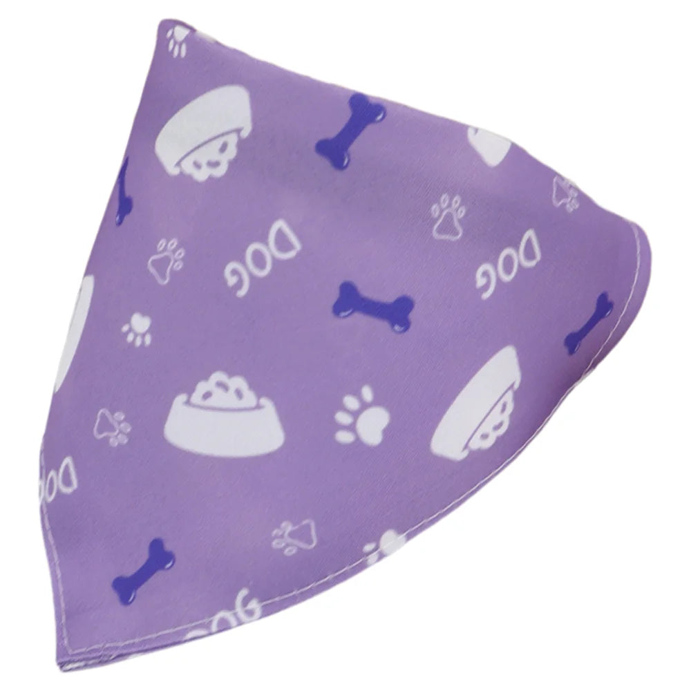 Purple cotton pet bandana with a white cartoon print of dog paw prints and bones.