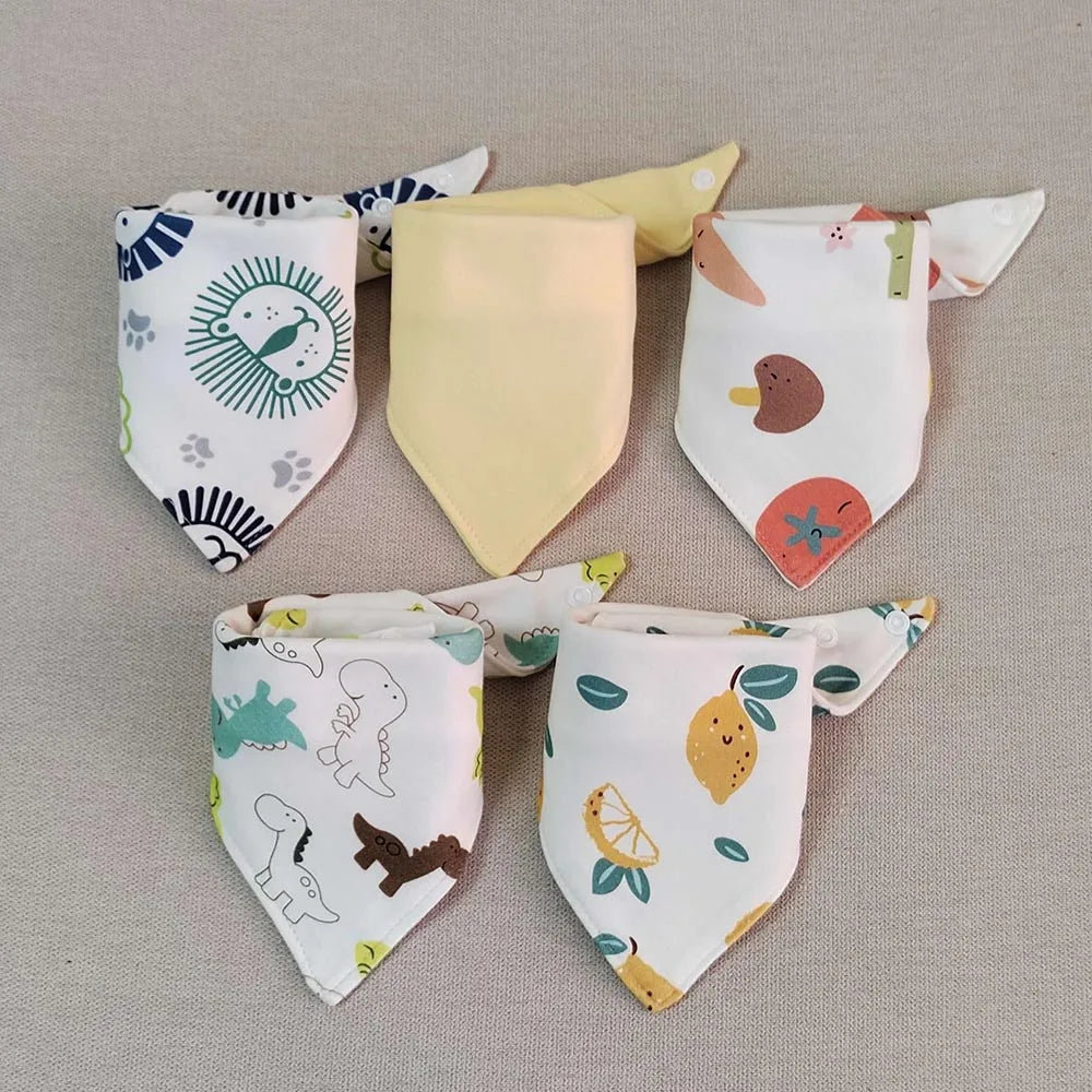A set of five cotton triangle baby bibs featuring various cartoon prints and colors.
