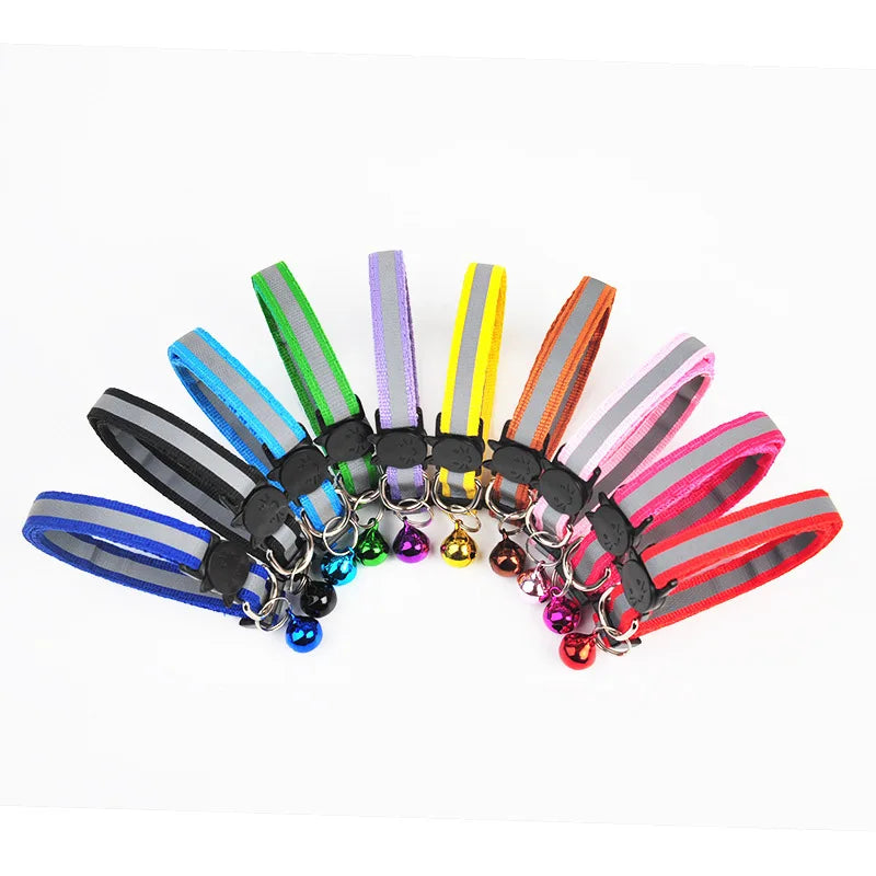 A collection of colorful reflective nylon pet collars with bells in various stripes and colors.