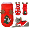 A red fleece dog sweater featuring deer antlers and a green Christmas tree design.