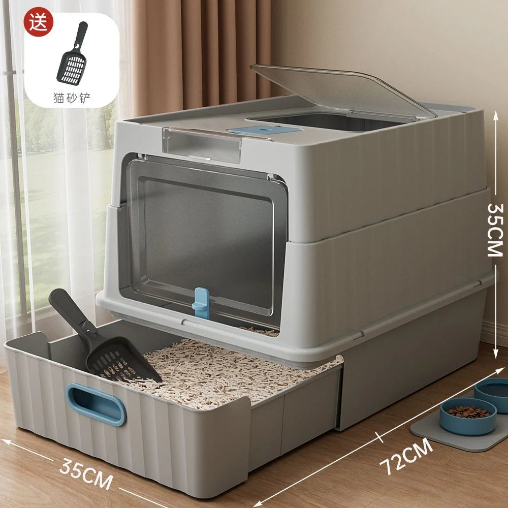 A light gray enclosed stainless steel cat litter box with a removable tray and a handle for easy access.