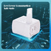 White motion-activated pet water fountain with a clear dispenser sitting on a blue circuit board.