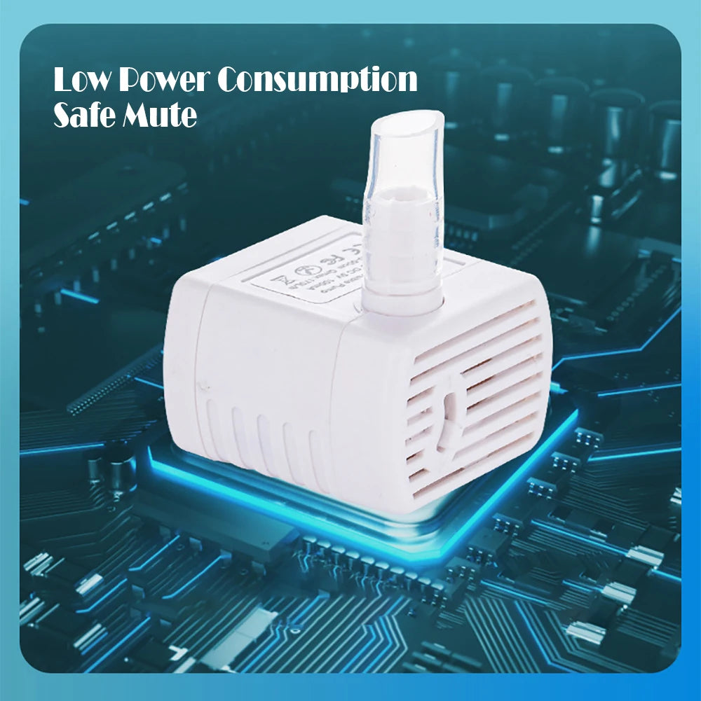 White motion-activated pet water fountain with a clear dispenser sitting on a blue circuit board.