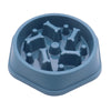 A light blue slow feeder dog bowl with an anti-slip base, featuring raised, textured compartments for food.