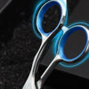 A pair of professional stainless steel pet grooming scissors with glowing blue accents.