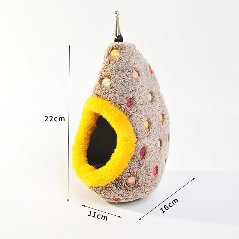 A fluffy, egg-shaped bird nest made of gray felt with colorful accents and a yellow entrance, shown with dimensions.