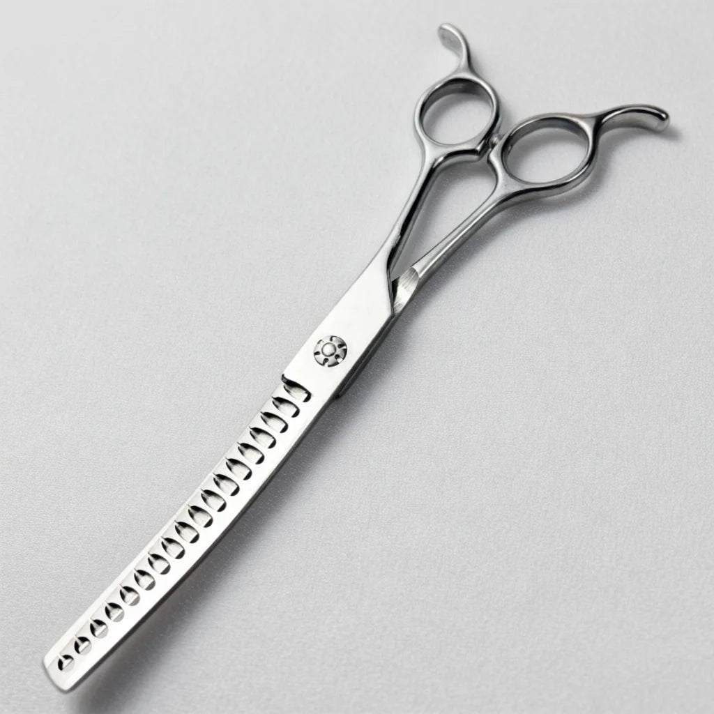 Silver professional pet grooming scissors with serrated blades and decorative markings