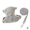 Gray pet leash harness for dogs and cats with a coiled leash attached