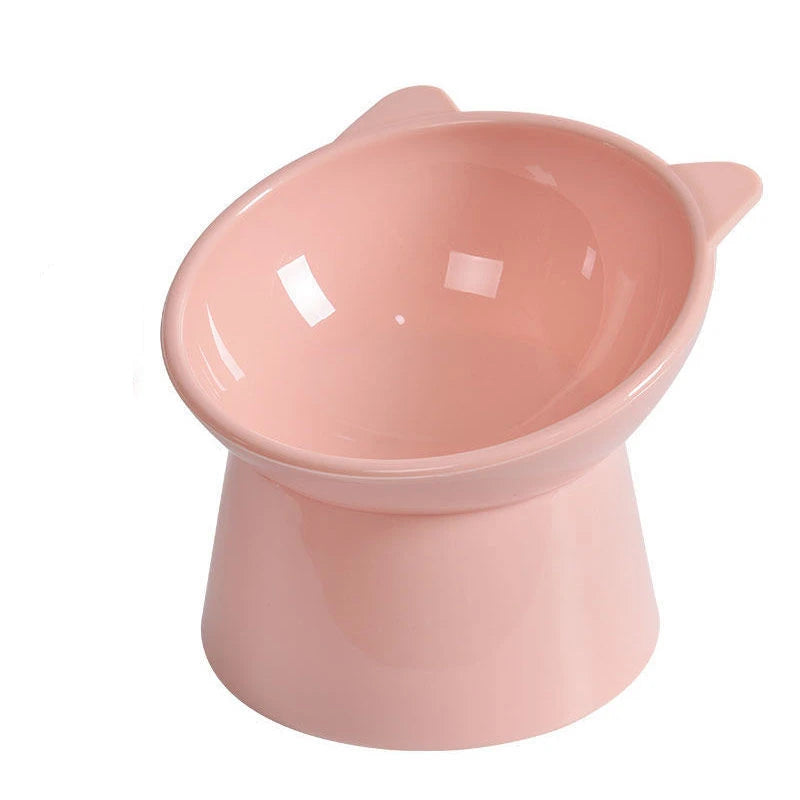 A pink ergonomic elevated pet bowl with a storage base for feeding cats and dogs.