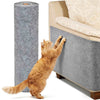 An orange tabby cat stretches its paw against a large gray self-adhesive sofa protector mat.