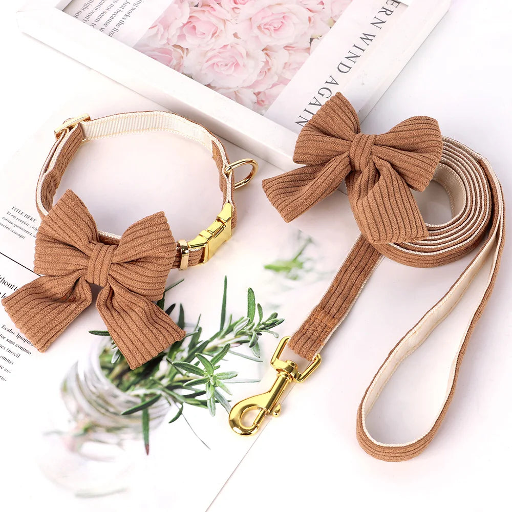 A brown velvet dog collar and leash set featuring a bowknot, displayed on a white background.