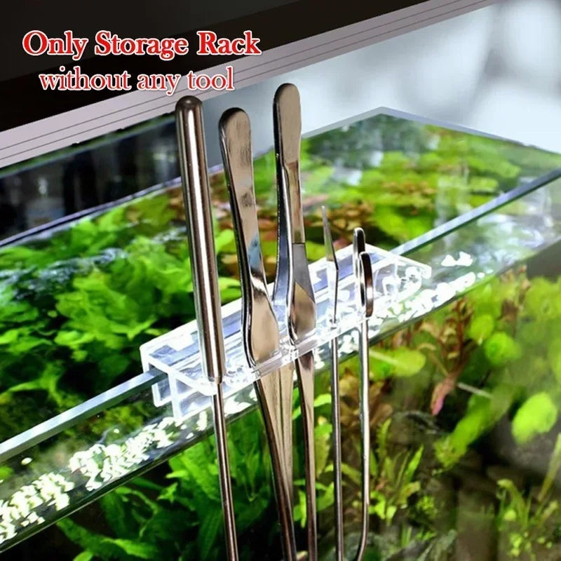 A set of stainless steel aquarium tools stored in an acrylic organizer box.