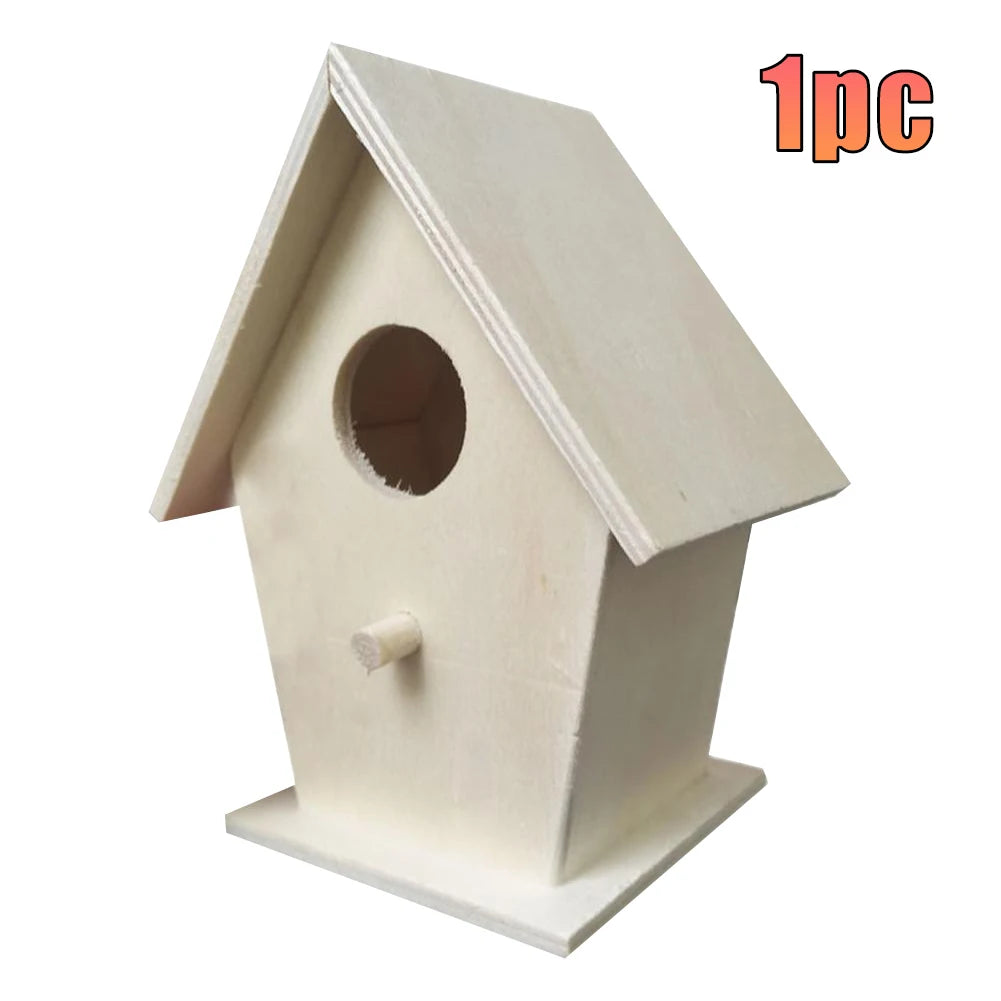 A white wooden wall-mounted bird house with a pitched roof and a circular entrance hole.