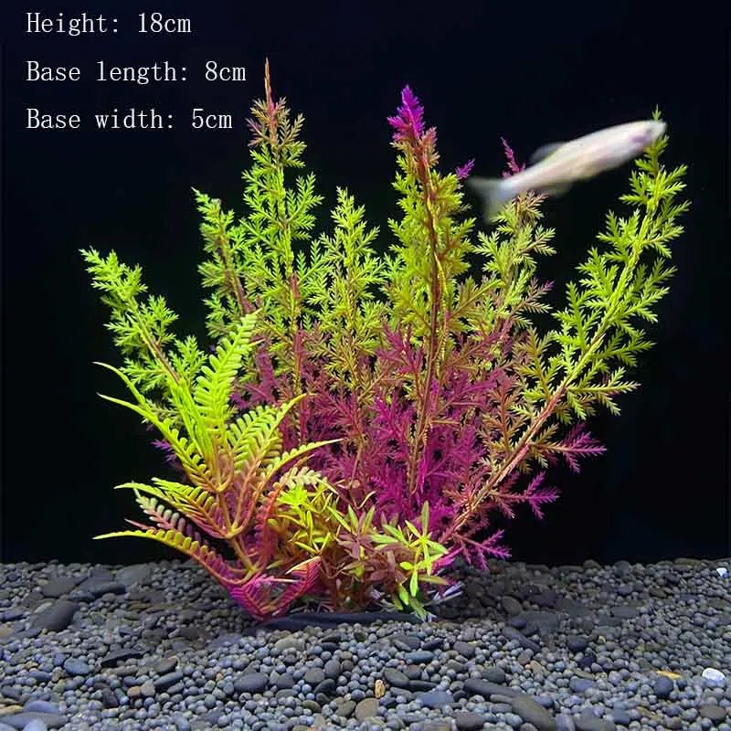 A vibrant artificial aquatic plant with pink and green foliage is shown growing in a gravel substrate.