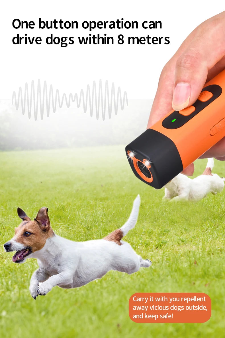 A hand holds an orange ultrasonic dog repeller device, with a white dog running nearby on green grass.
