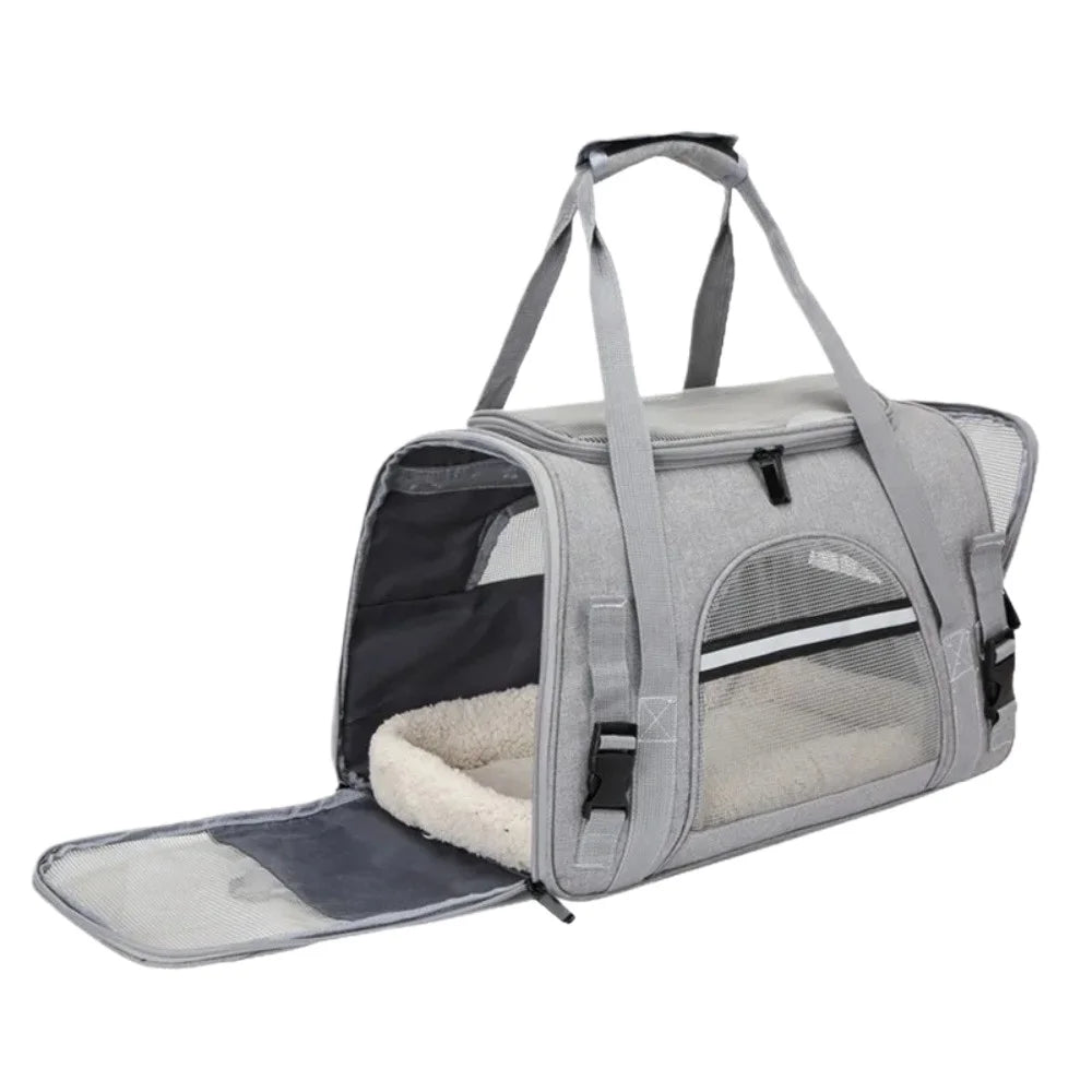 A light gray foldable pet travel carrier bag with a mesh window and carrying handles.