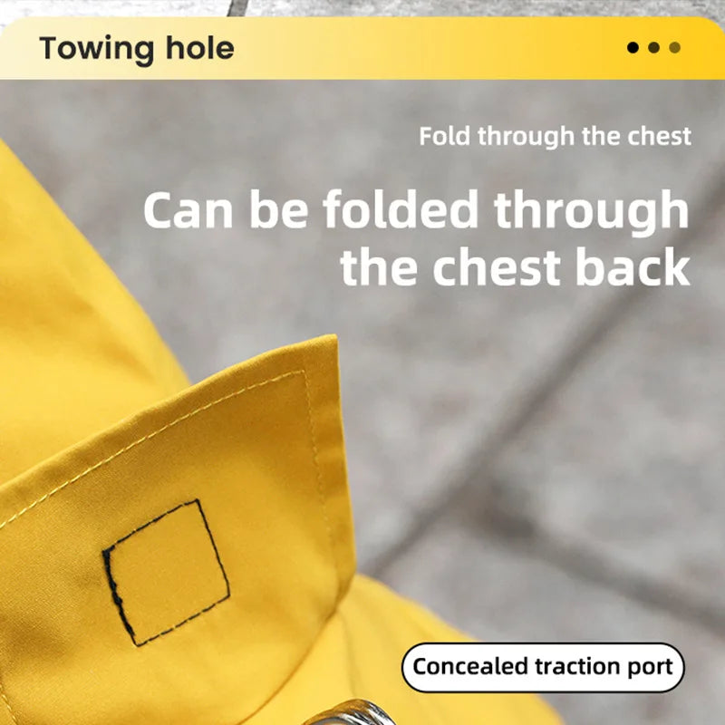 A yellow dog raincoat is shown folded through the chest, highlighting a concealed traction port.