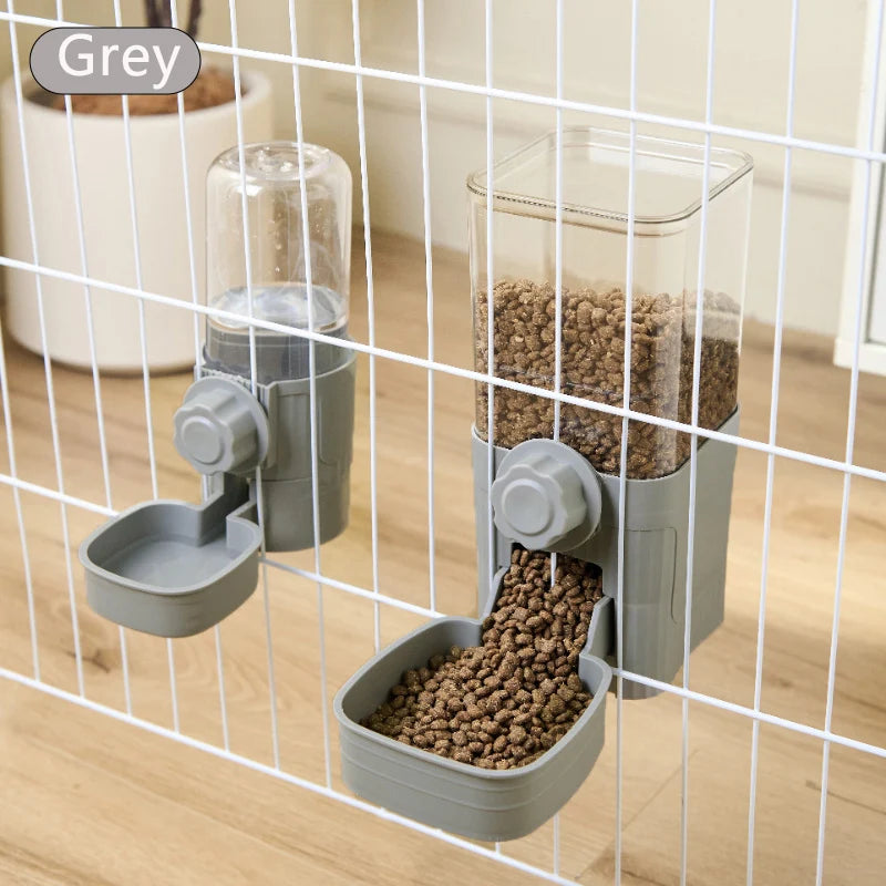 A grey automatic pet feeder waterer for dogs and cats is shown inside a wire cage.