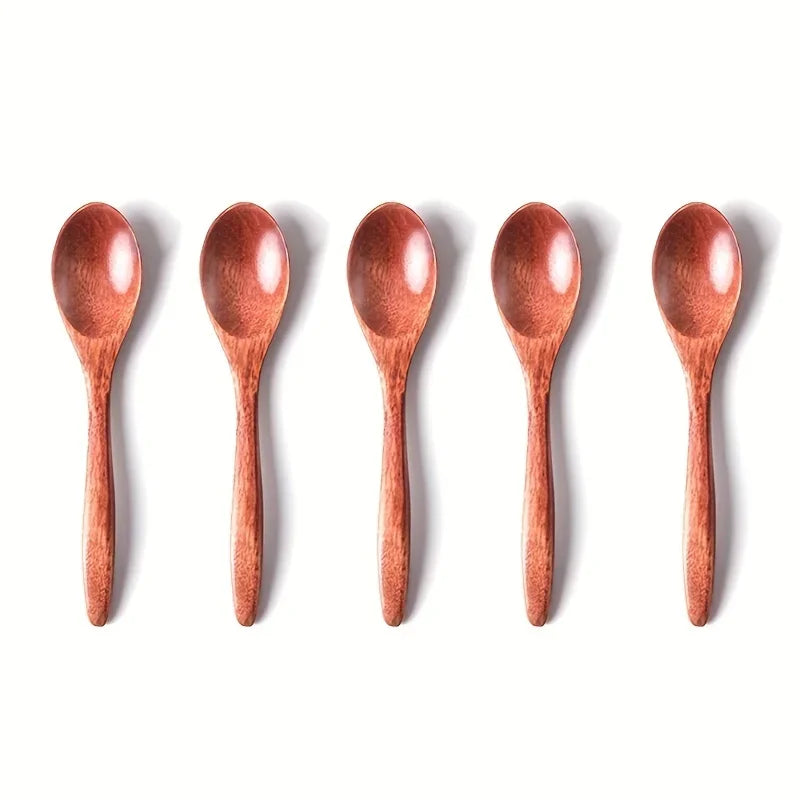 A set of six wooden tea and coffee spoons arranged in a row.