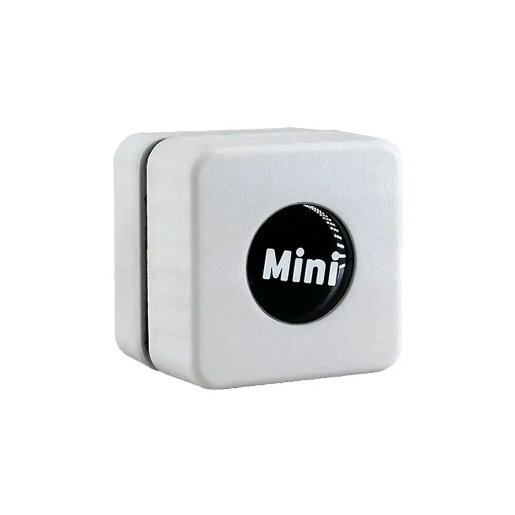 A white magnetic aquarium glass cleaner device with a round black cleaning disc.