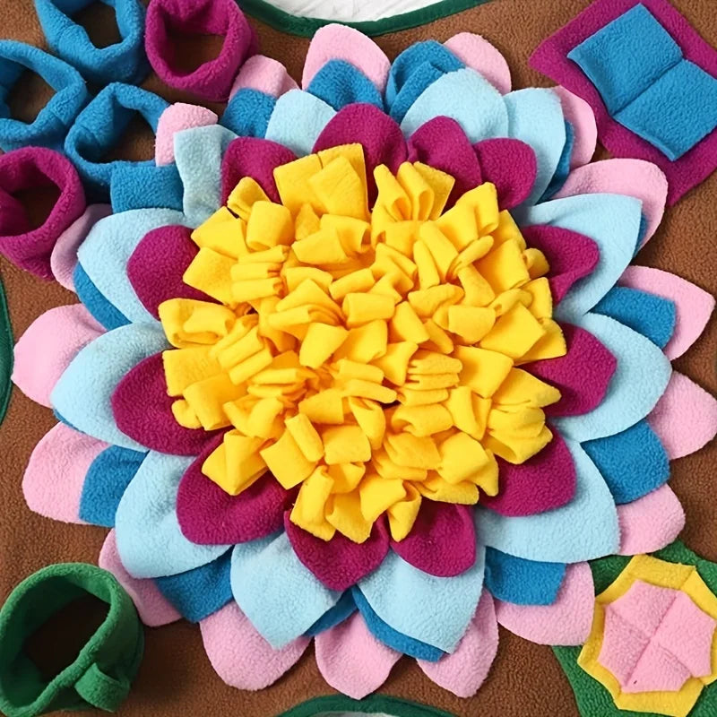 Colorful felt flower craft featuring various shades of blue, pink, purple, and yellow.