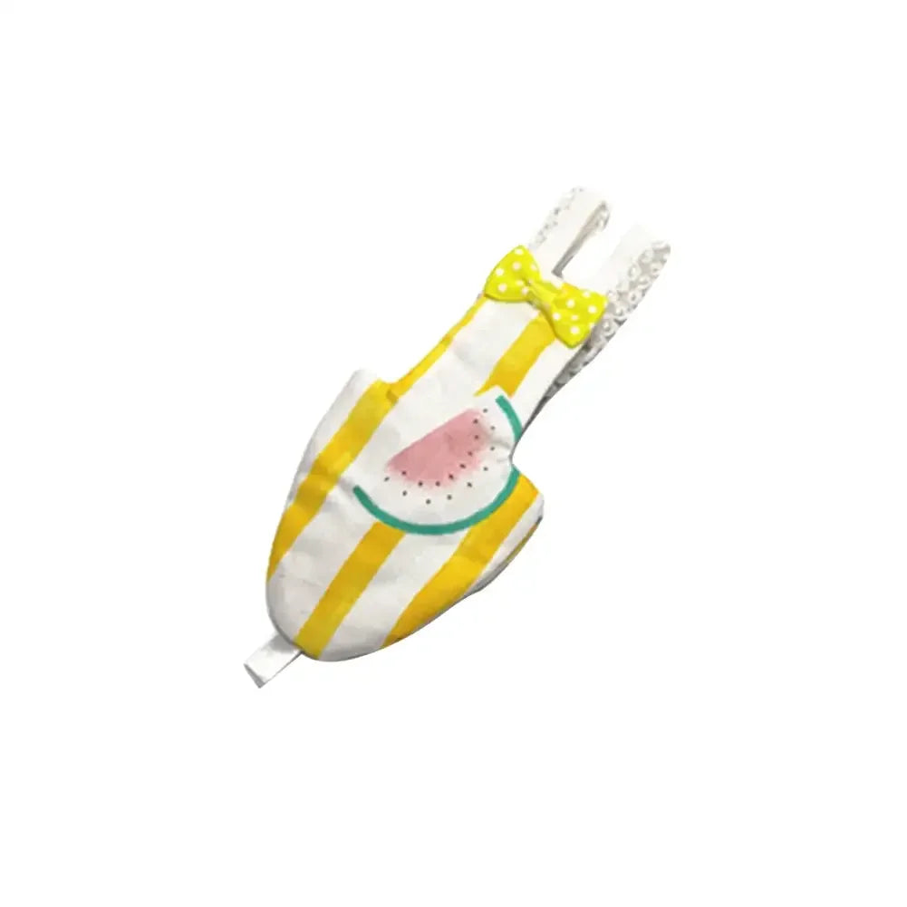 A yellow and green cotton parrot flight suit with a pink watermelon design and a yellow bow.