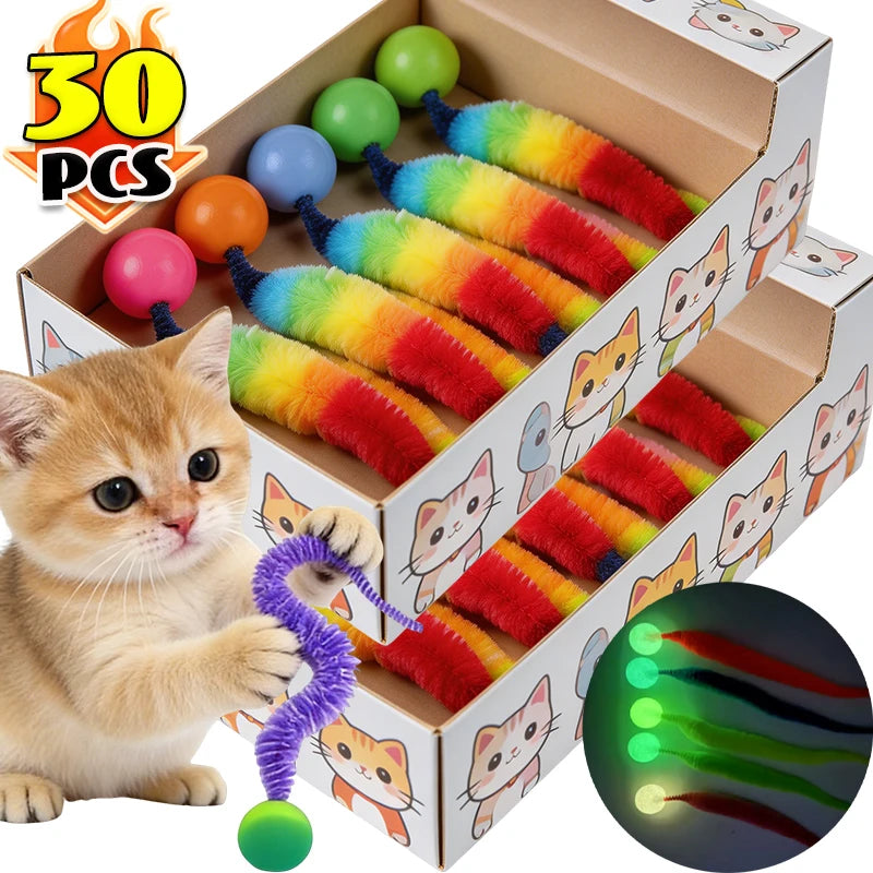 A box of interactive cat toys featuring colorful, fuzzy caterpillar-shaped balls and cat faces.