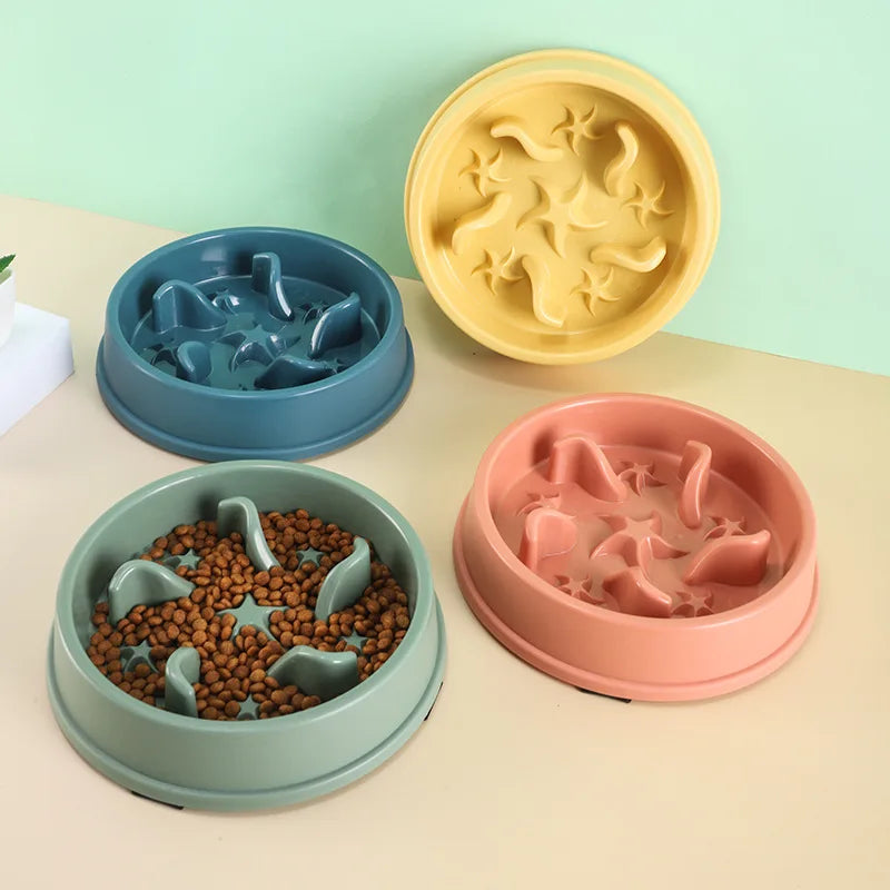 A set of three anti-slip slow feeder bowls in yellow, blue, and pink for small dogs and cats.