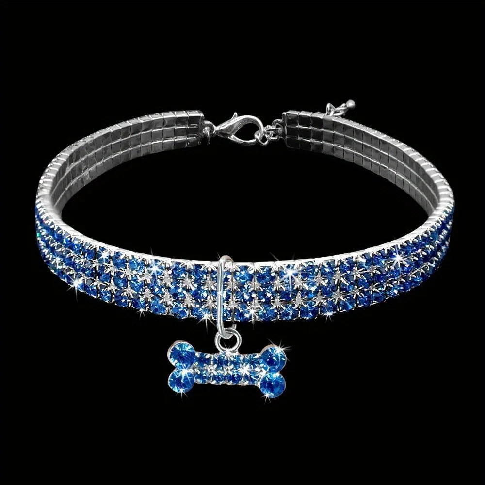 A silver collar adorned with blue diamonds shaped like a bowknot for pets.