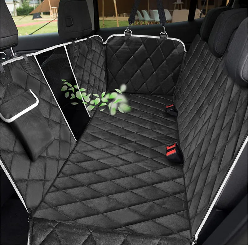 Black quilted waterproof dog car backseat cover installed in a vehicle interior.