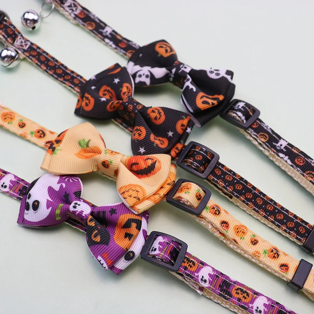 Adjustable Halloween pet collar featuring a bow tie, bell, and patterned fabric.