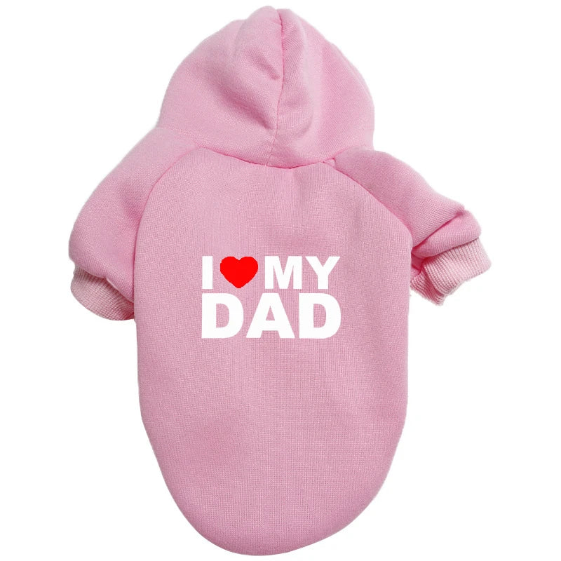 A pink plush winter hoodie with the text I love my dad printed on the chest.