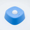 A bright blue non-slip silicone lick mat slow feeder bowl for dogs and cats.