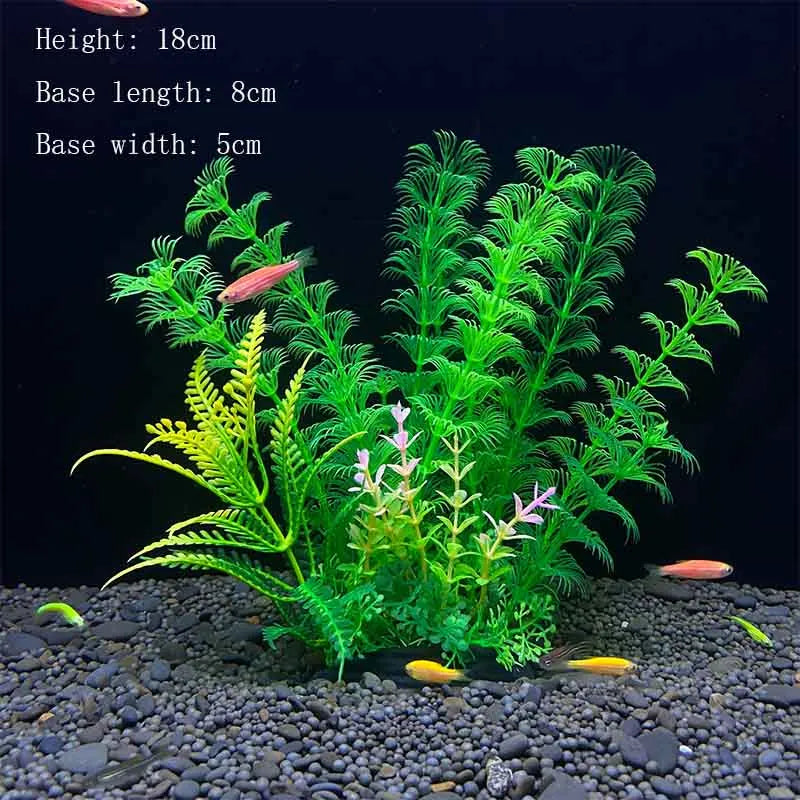 A vibrant green artificial aquarium plant with fine feathery leaves is displayed on a dark gravel substrate.
