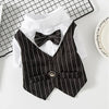 A black and white striped tuxedo shirt and vest outfit for pets, laid on a grid background.