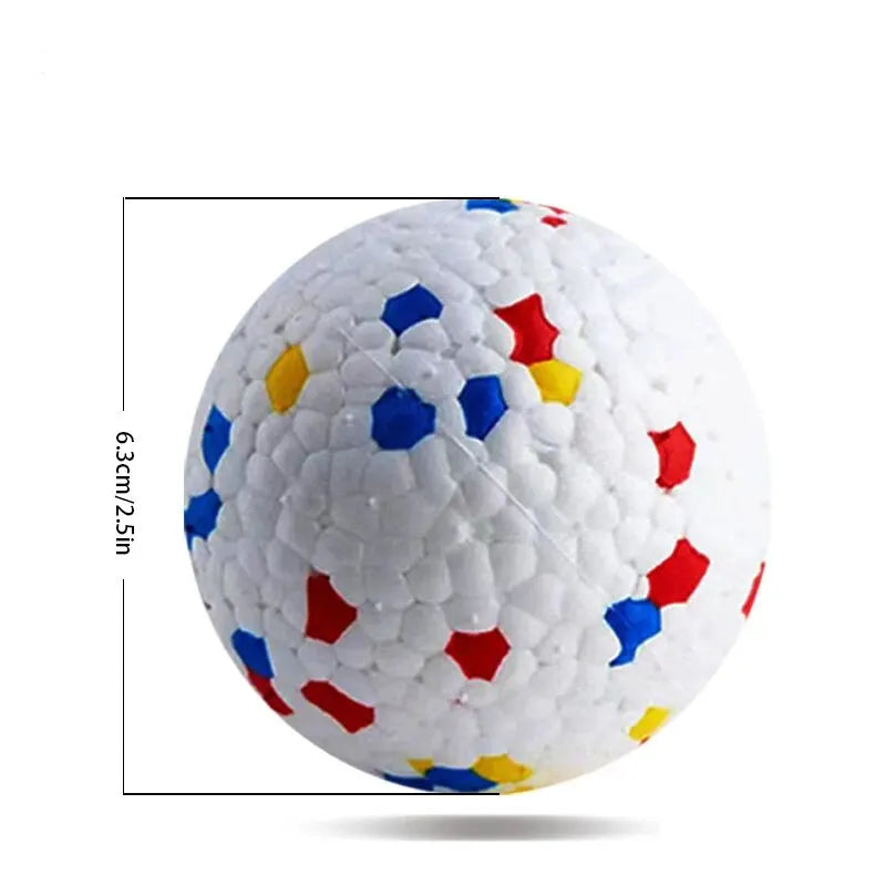 A white TPU dog chew ball with colorful, irregularly shaped inserts for interactive play and dental health.