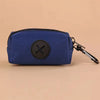 A dark blue fabric pouch with a black circular logo and a metal carabiner clip.