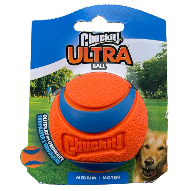 A package of Chuckit Ultra Ball for dogs showing an orange and blue rubber ball in a grassy outdoor setting.