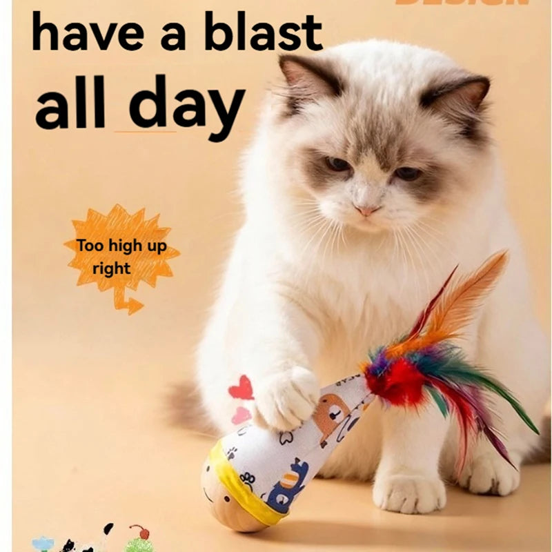 A fluffy white cat is playing with an interactive feather wobble toy.