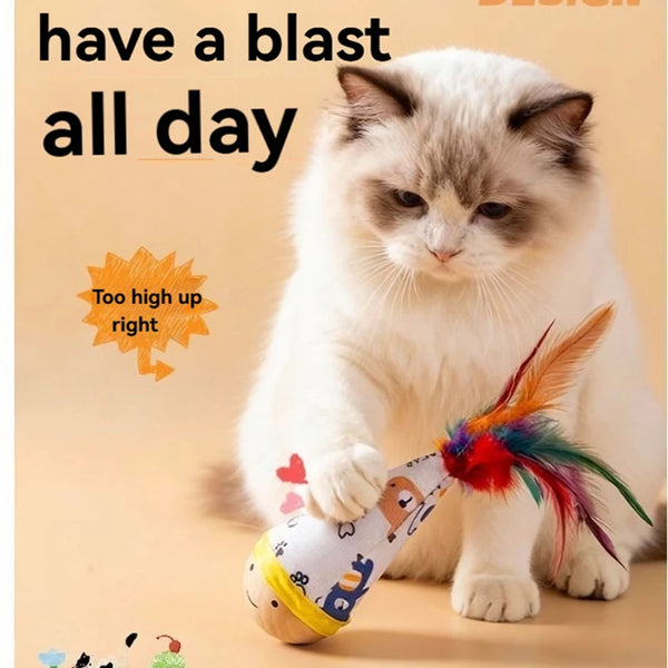 A fluffy white cat is playing with an interactive feather wobble toy.