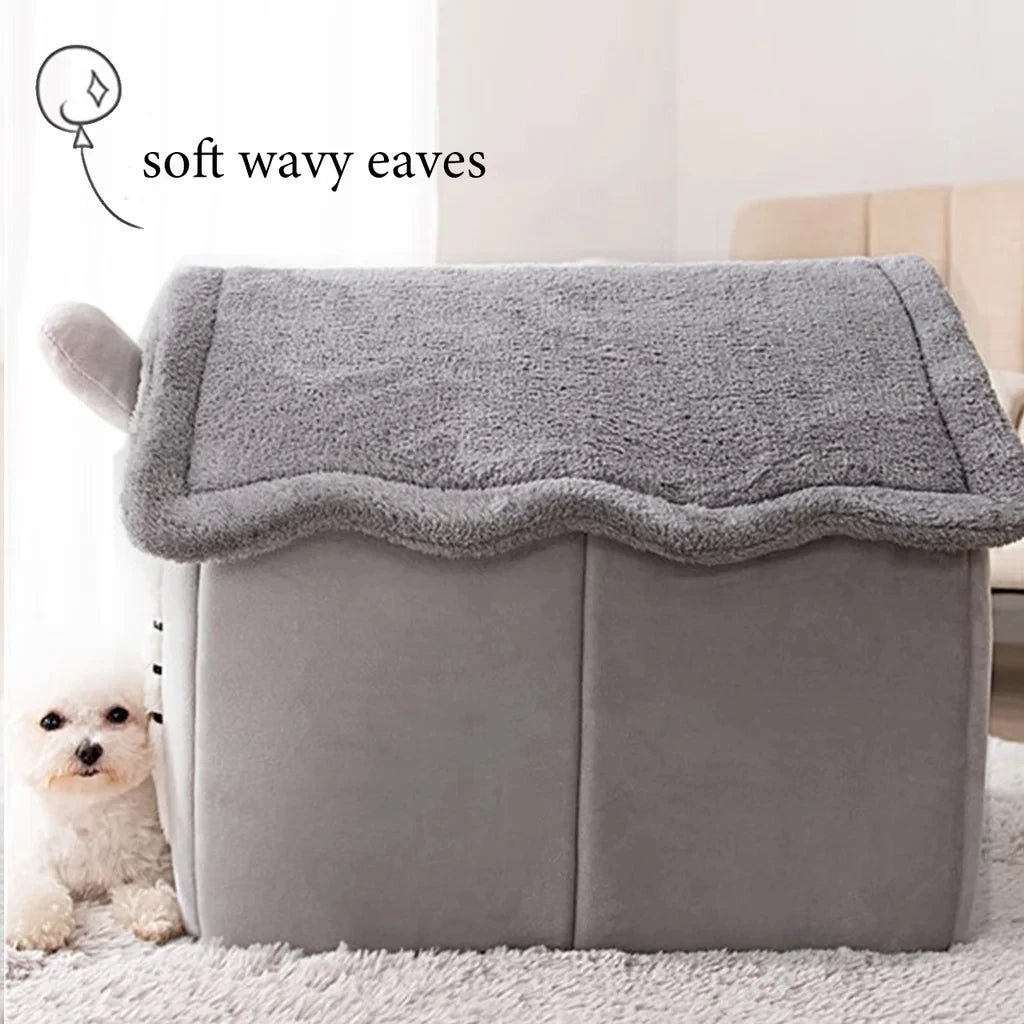 A gray foldable pet bed with a soft wavy cover resting on a white rug.
