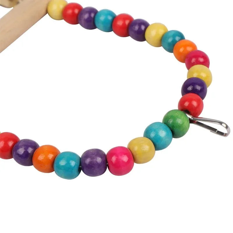 A colorful beaded bird swing necklace made of wooden beads with a silver clasp.